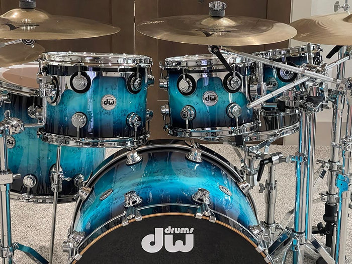 Mappa Teal to Black Wood Grain Fade drum wrap installed on a DW drum kit